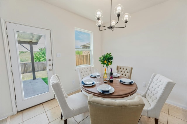 tiled dining area featuring a notable chandelier