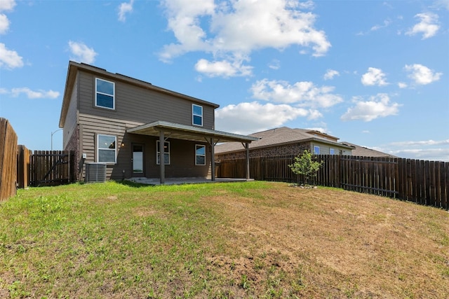 back of property featuring a yard, a patio, and central AC unit