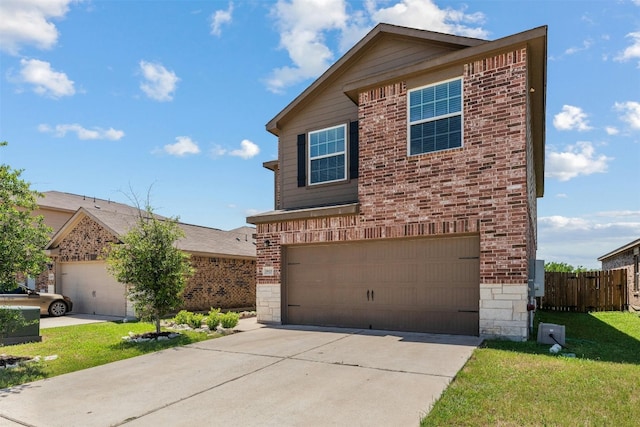 view of front property with a front yard and a garage