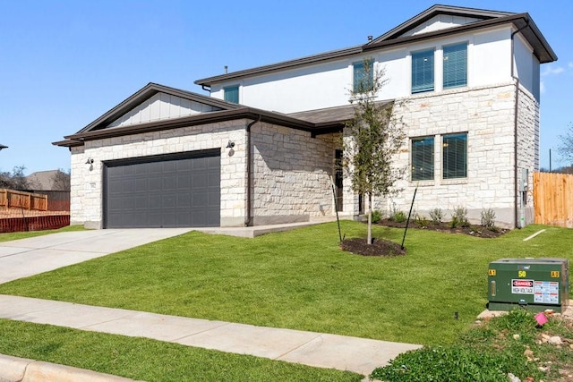 view of front of property with a garage and a front lawn