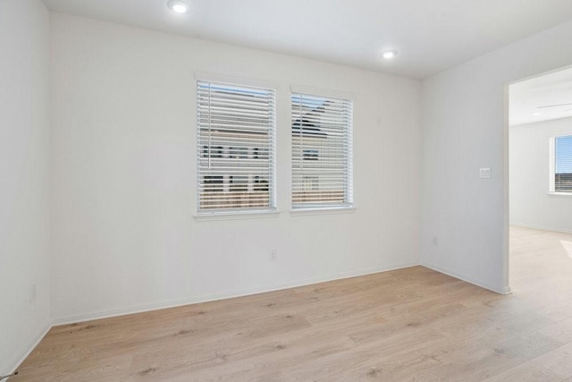 spare room featuring light hardwood / wood-style flooring