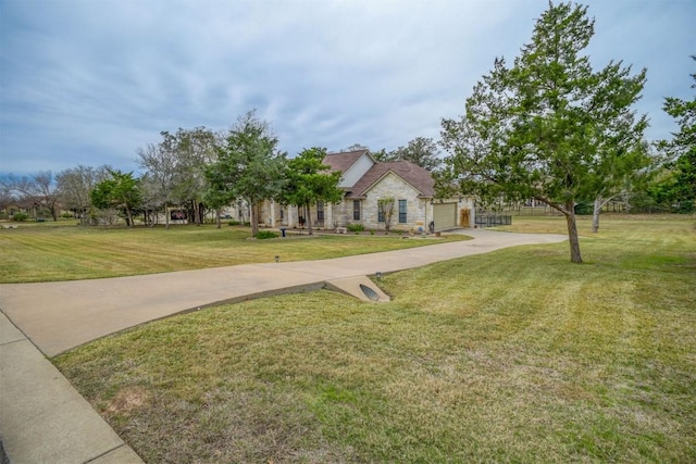 view of front of home featuring a garage and a front lawn