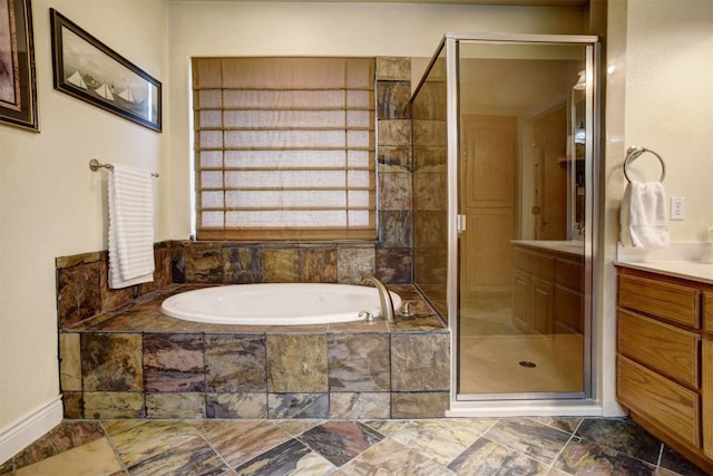 bathroom featuring vanity and plus walk in shower