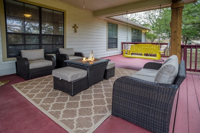 wooden terrace with an outdoor fire pit