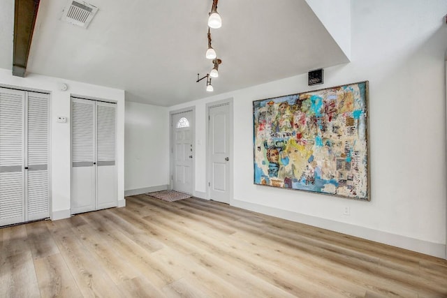 entrance foyer featuring light wood-type flooring