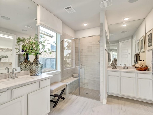 bathroom with vanity and an enclosed shower