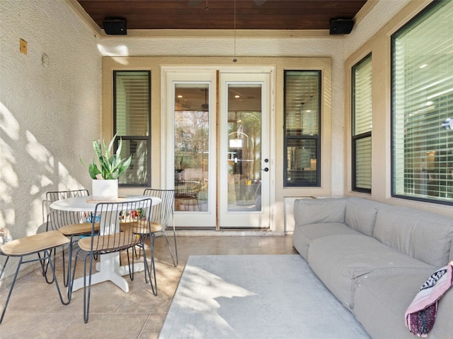 entrance to property featuring a patio and an outdoor hangout area