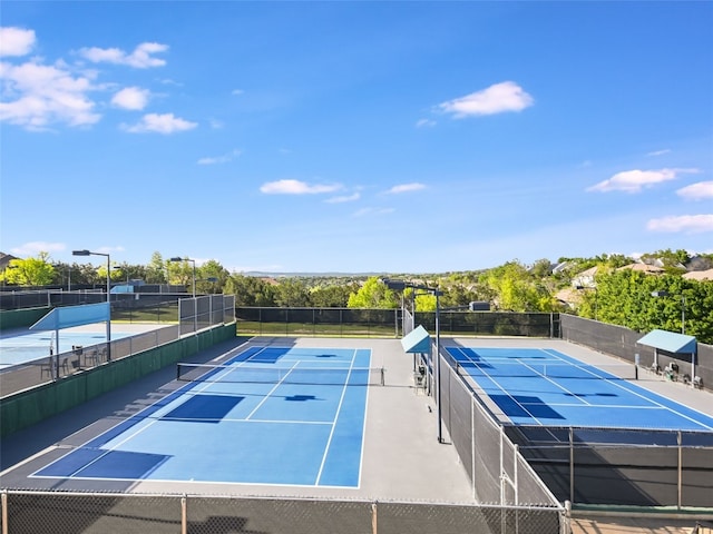 view of sport court with basketball hoop