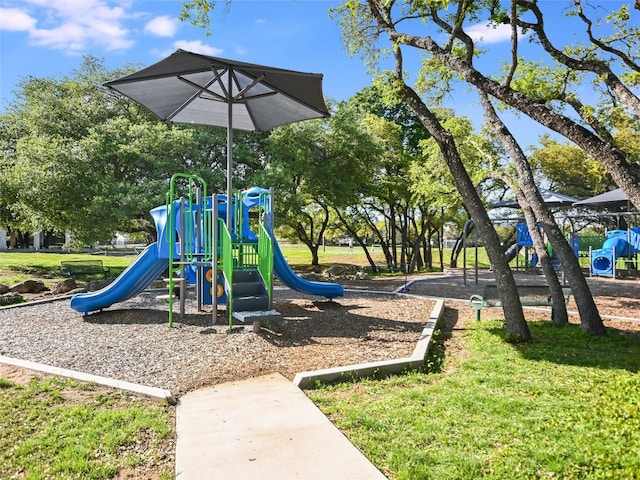 view of playground featuring a lawn