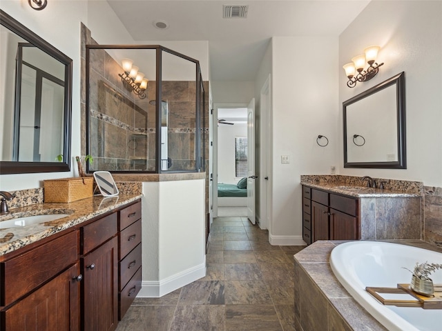 bathroom featuring ceiling fan, walk in shower, and vanity