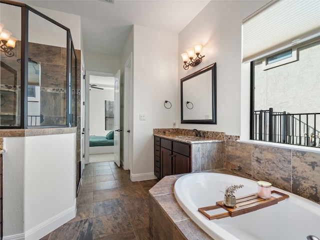 bathroom featuring vanity, ceiling fan, and plus walk in shower