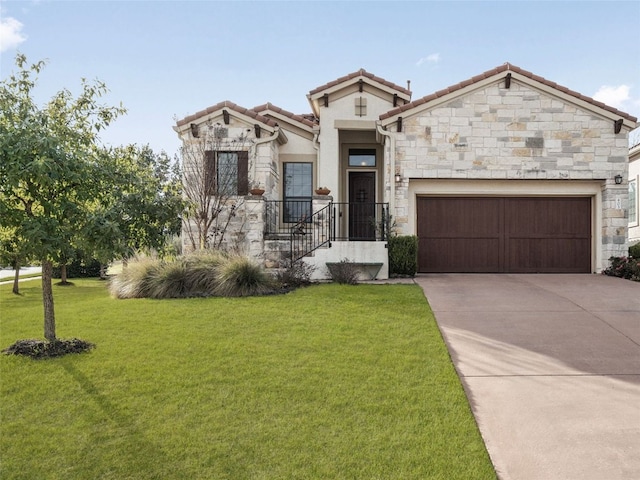 view of front of home with a garage and a front lawn