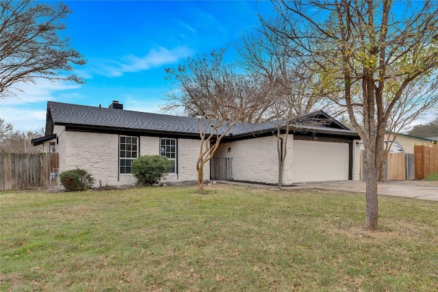 ranch-style house with a front yard and a garage