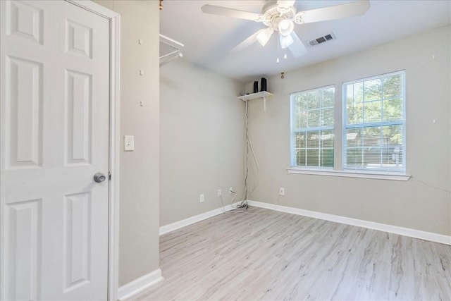 spare room with ceiling fan and light hardwood / wood-style flooring