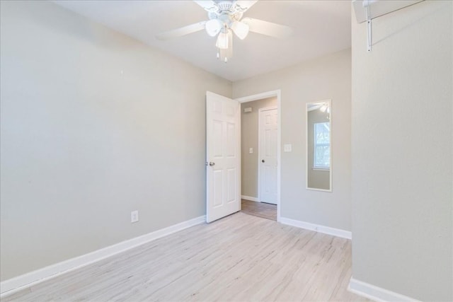 spare room featuring ceiling fan and light hardwood / wood-style flooring