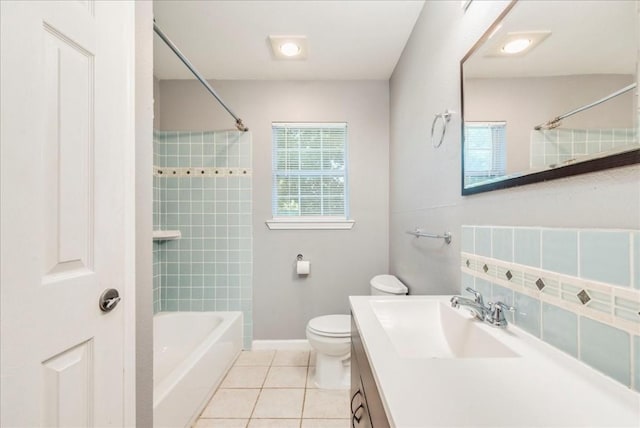 full bathroom featuring tile patterned flooring, backsplash, vanity, toilet, and tiled shower / bath