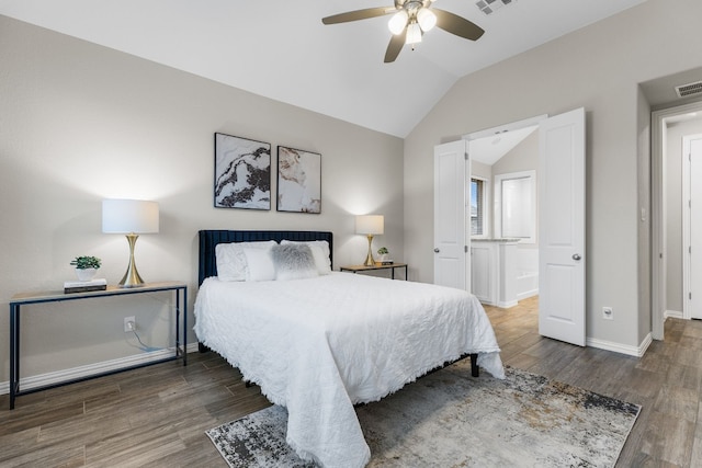 bedroom featuring vaulted ceiling, ceiling fan, and dark hardwood / wood-style floors