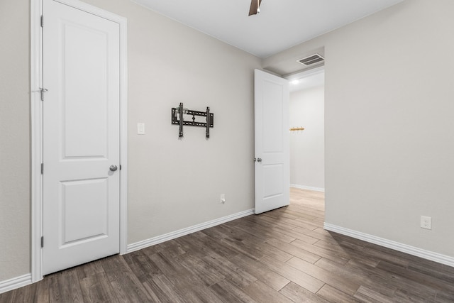 empty room featuring dark wood-type flooring