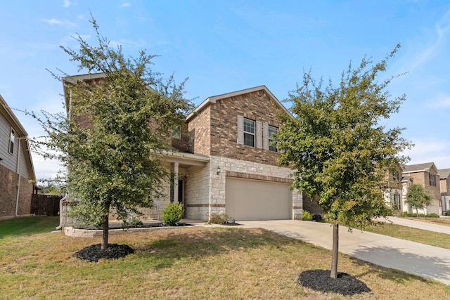 view of front of property featuring a garage and a front lawn