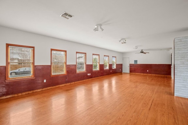 spare room featuring ceiling fan and light hardwood / wood-style floors