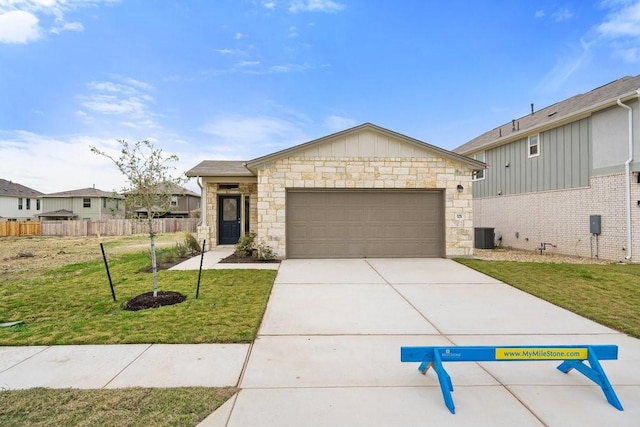 view of front of home with a front yard and a garage