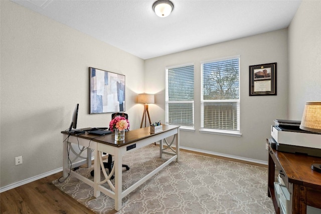 office space with light wood-type flooring