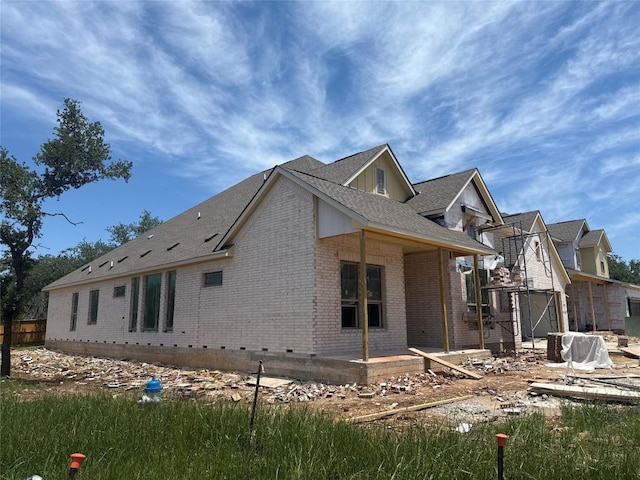 1748 Snowdrop Dr, Georgetown, TX 78628 - view of side of home with brick siding