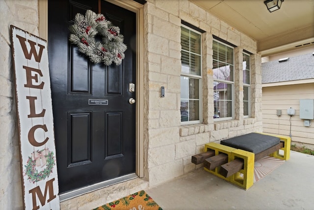 property entrance featuring covered porch