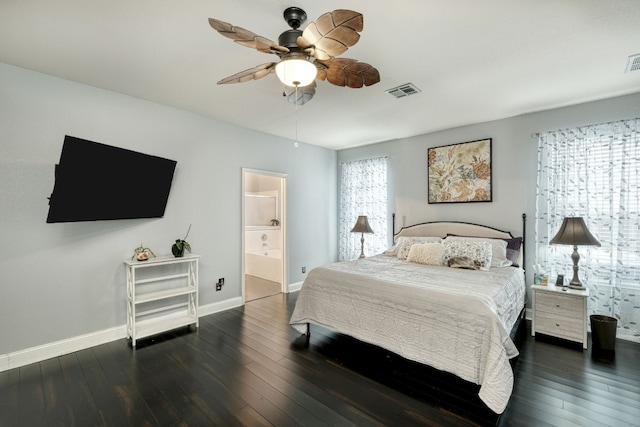 bedroom with dark hardwood / wood-style floors, ensuite bath, and ceiling fan