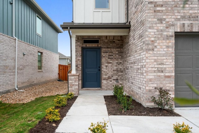 doorway to property featuring a garage