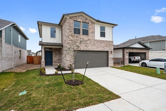 view of front of house with a front yard and a garage