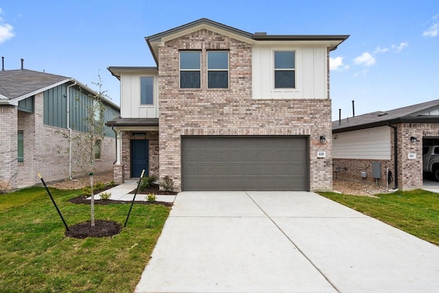 view of front of property with a garage and a front lawn