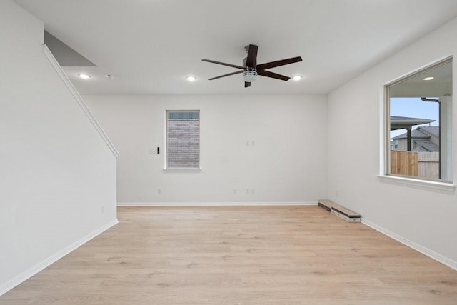 spare room with ceiling fan and light hardwood / wood-style flooring