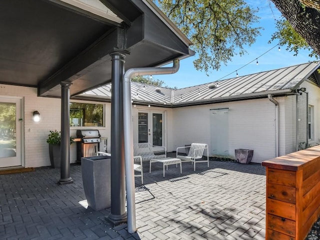 view of patio / terrace featuring area for grilling and french doors