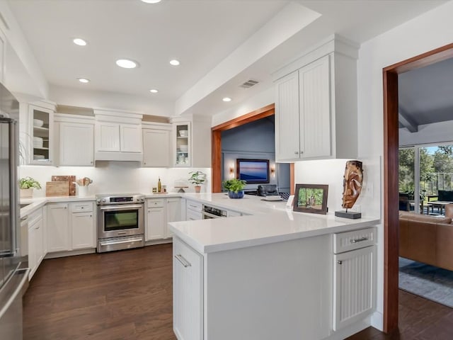 kitchen with kitchen peninsula, decorative backsplash, dark hardwood / wood-style flooring, electric stove, and white cabinets