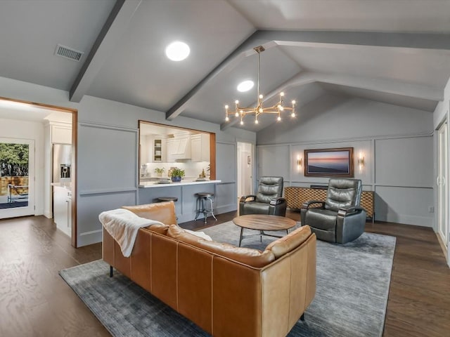 living room with dark hardwood / wood-style flooring, lofted ceiling with beams, and a notable chandelier