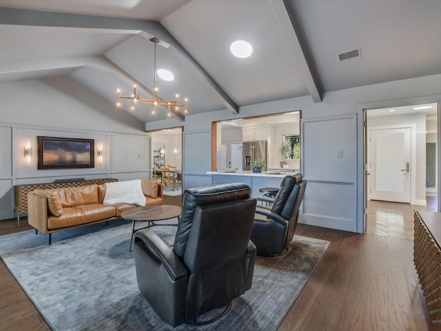 living room featuring a notable chandelier, vaulted ceiling with beams, and dark hardwood / wood-style floors