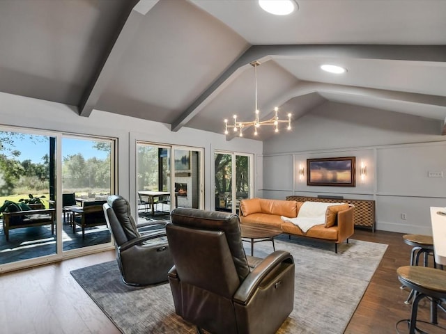 living room with vaulted ceiling with beams, dark hardwood / wood-style flooring, and a notable chandelier