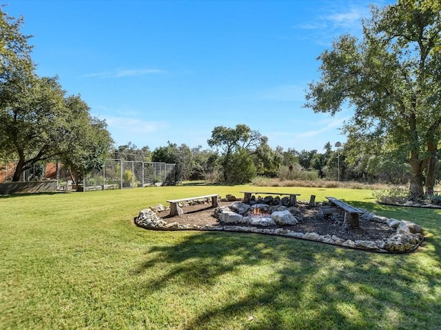 view of yard featuring an outdoor fire pit