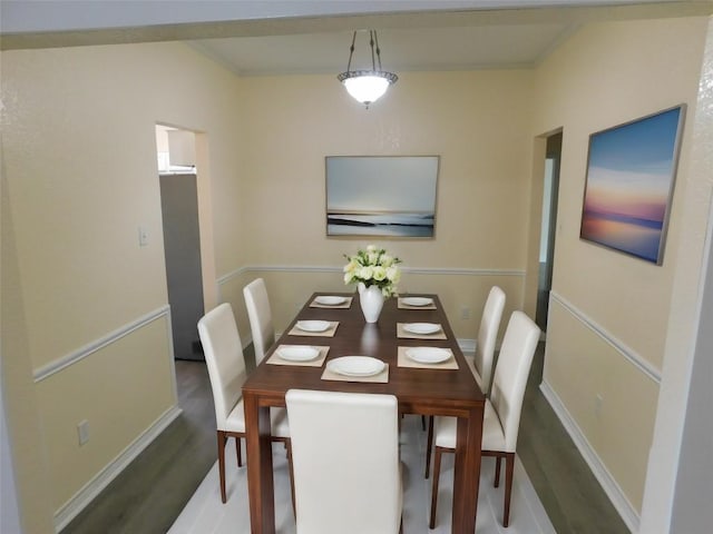 dining space featuring dark wood-type flooring