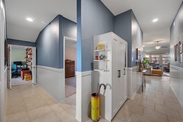 corridor featuring light tile patterned flooring