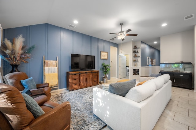 tiled living room featuring vaulted ceiling and ceiling fan