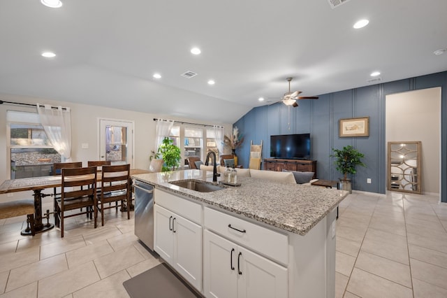 kitchen with white cabinets, sink, a center island with sink, dishwasher, and lofted ceiling