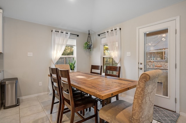 dining space featuring light tile patterned flooring