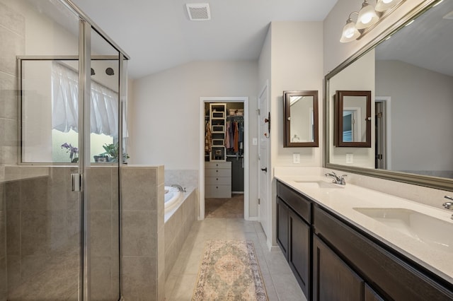 bathroom with separate shower and tub, tile patterned flooring, and vanity