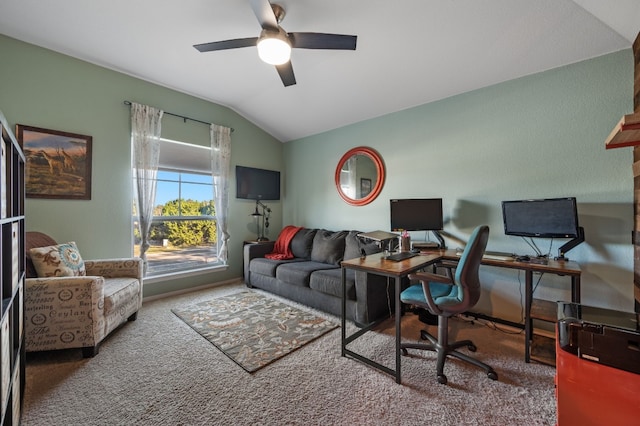 carpeted home office with ceiling fan and lofted ceiling