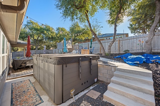 view of patio featuring a hot tub