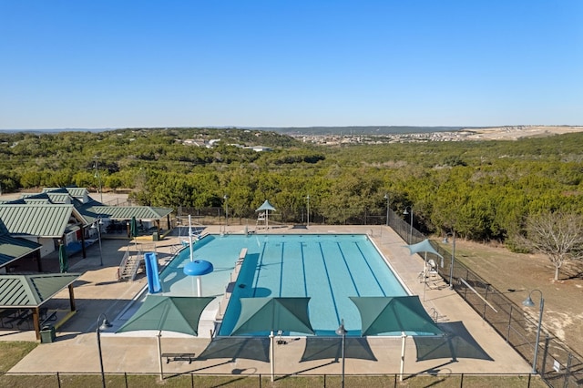 view of swimming pool with a patio