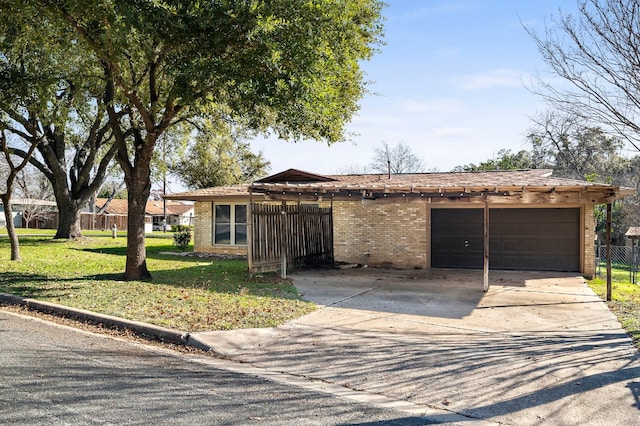 view of front of house with a front yard and a garage