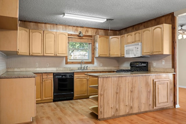 901 Berrywood Dr, Austin, TX 78753 - kitchen with black appliances, light brown cabinets, a sink, a textured ceiling, and light wood-style floors